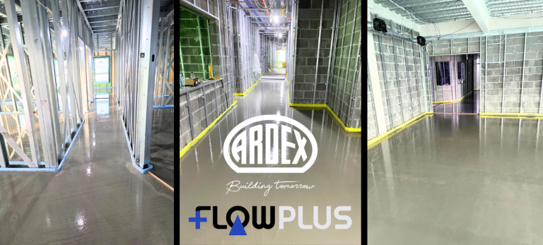 Construction site hallway with a glossy epoxy floor, metal stud framing, and a central panel showing ARDEX and FlowPlus logos.