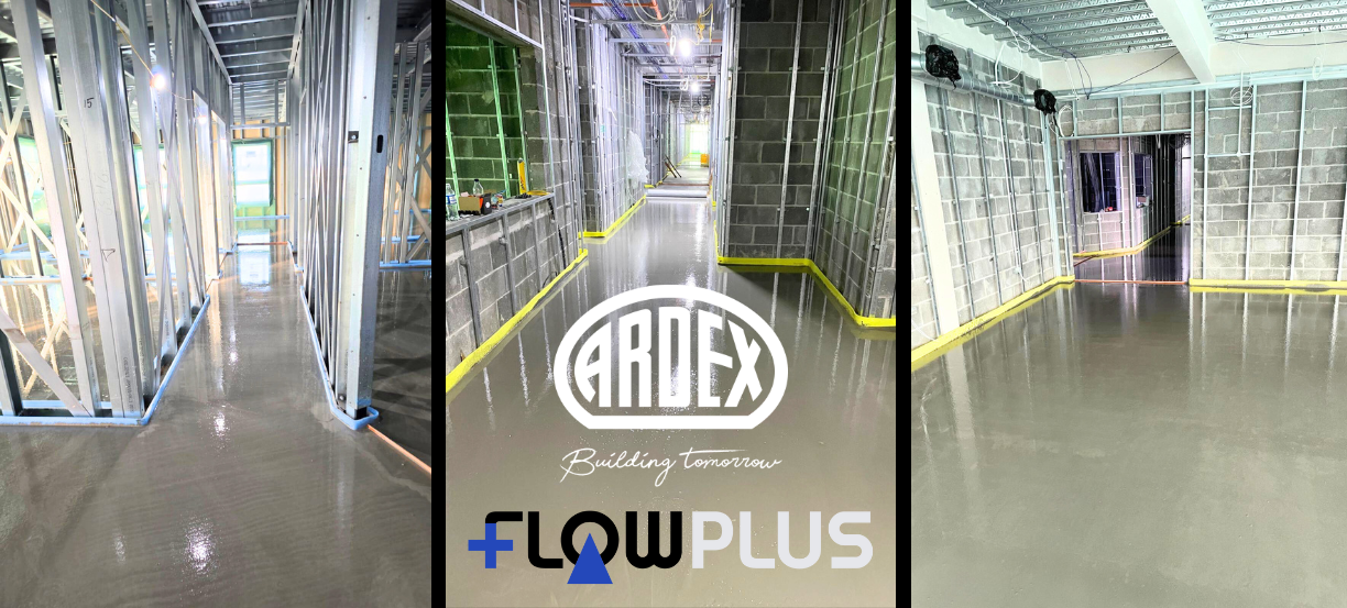 Construction site hallway with a glossy epoxy floor, metal stud framing, and a central panel showing ARDEX and FlowPlus logos.