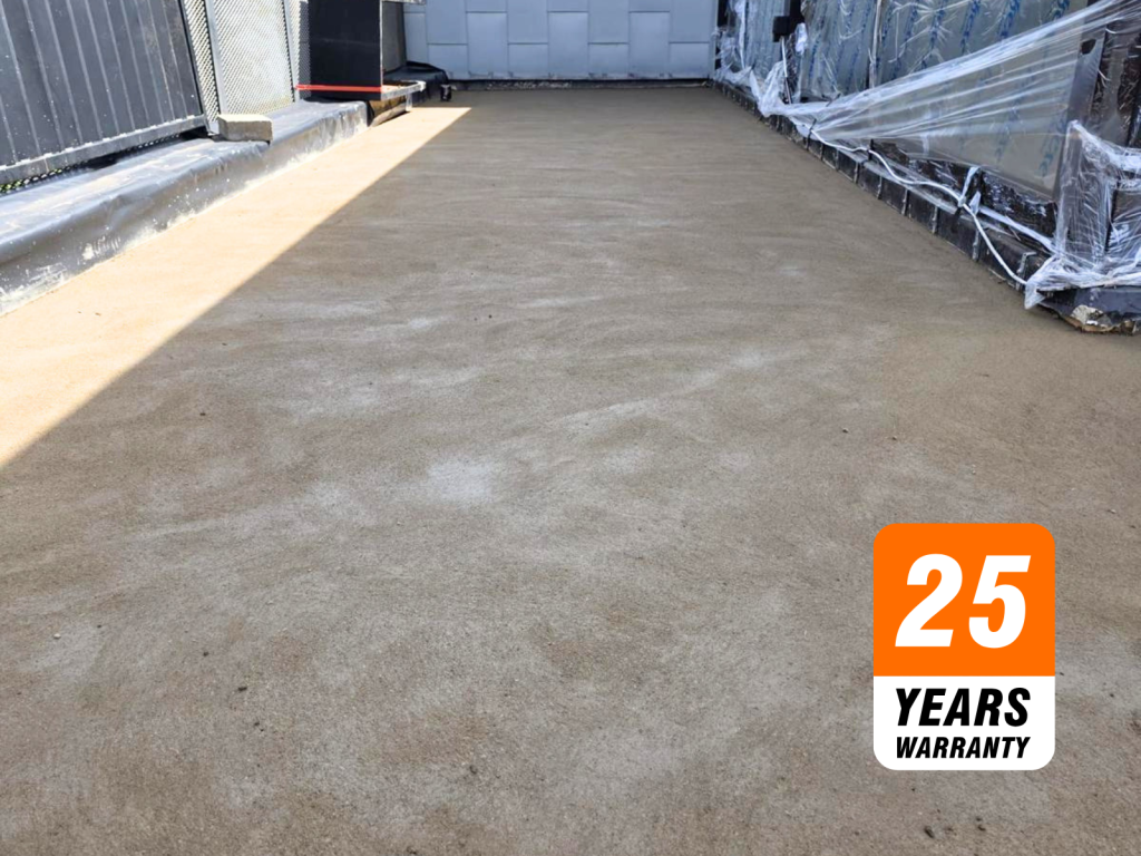 Wide rooftop or construction site with fresh cement surface; orange 25 Years Warranty badge overlays the lower right corner.